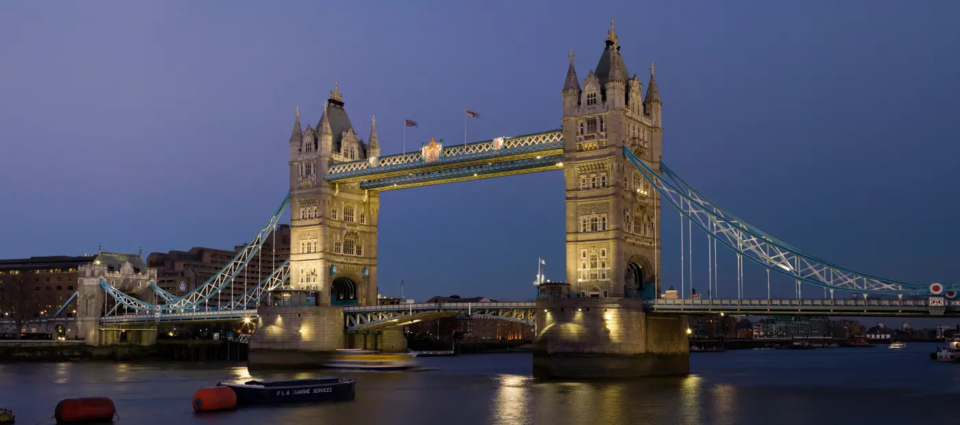 Tower Bridge illuminated over the Thames at dusk