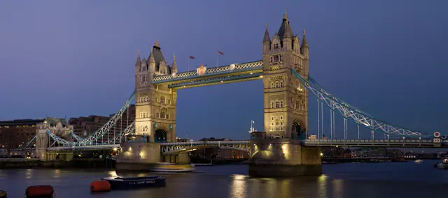 Tower Bridge illuminated over the Thames at dusk