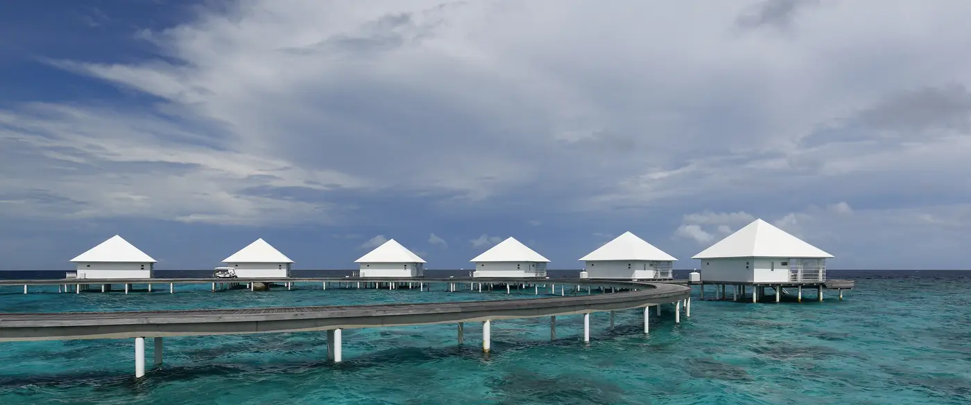 Overwater villas and a wooden walkway in the Maldives