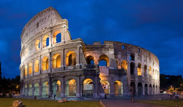 The Colosseum illuminated at blue hour in Rome